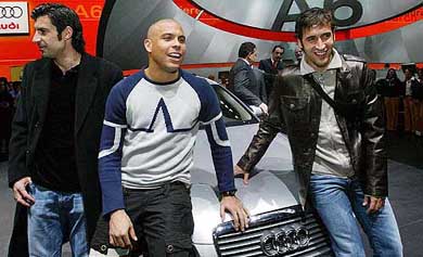 Real Madrid soccer players, Figo, Ronaldo and Raul, from left to right, pose on the new Audi A 6 at the 74th Geneva International Motor Show
