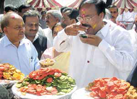 Delhi State BJP President Dr Harshvardhan and BJP national president Venkaiah Naidu having gol-gappas during the Holi Mangal Milan function at Delhi Pradesh BJP office in the Capital on Friday.