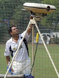 Sachin Tendulkar adjusts a bowling machine during net practice in Mumbai on Friday. The Indian cricket team is scheduled to arrive in Pakistan on March 10 to play five one-day internationals between March 13 and 24. The master blaster said he was looking forward to India's first full tour of Pakistan after 14 years and that the team would focus on cricket and try to put a good show.