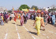 Girls take part in pitcher race during Hola Mohala celebrations organised by the Guru Gobind Singh Sikh Study Circle in Ludhiana