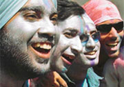 Youngsters with faces painted with metallic colours add cheer to the Holi celebrations in Ludhiana