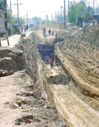 Work on the underground sewer project in progress on the Samrala-Khanna road in Samrala
