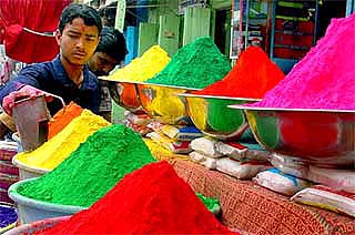 A vendor sells Gulal on the eve of Holi in Bhopal