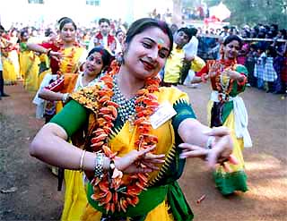Students of Vishva Bharati University perform at the 'Basanto Utsav', a function organised to celebrate Holi