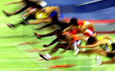 Athletes compete in the 60-m hurdles' heats at the World Indoor Athletics Championships in Budapest 