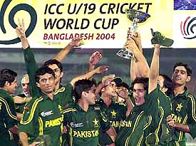 Pakistani U-19 cricketers celebrate with the trophy after beating the West Indies in the final of the U-19 Cricket World Cup 