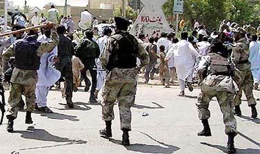 Pakistan paramilitary force disperses supporters of slain lawmaker Abdullah Murad, protesting against the killing in Karachi on Saturday