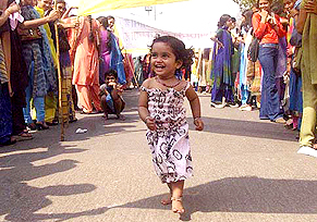 A little girl leads activists of Nari Raksha Samiti at a rally to mark International Women’s Day in New Delhi
