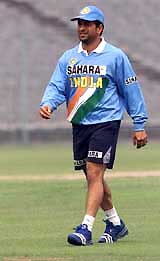 India's star batsman Sachin Tendulkar warms-up during a practice session in Kolkata on Monday. The Indian cricket team is scheduled to arrive in Pakistan