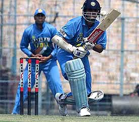 Indian skipper Sourav Ganguly play a shot as teammate VVS Laxman looks on