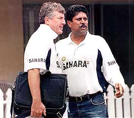 Coach John Wright discuses with former captain and bowling coach Kapil Dev in Kolkata 