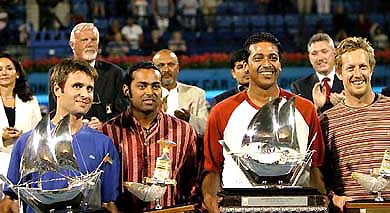 Leander Paes of India, Jonas Bjorkman of Sweden, Mahesh Bhupathi of India and Fabrice Santoro of France hold their trophies in Dubai on Sunday