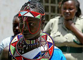 A prisoner displays a Samburu traditional outfit at a fashion show organised to celebrate International Women's Day at the Langata women's prison in Nairobi 