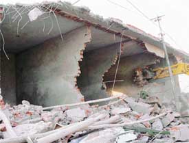 Unauthorised shops being demolished in Ambala on Tuesday.