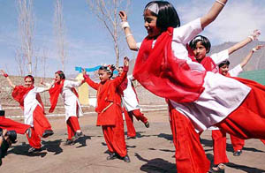 Schoolchildren from the border areas of Jammu and Kashmir perform at a function in Uri