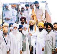 The SAD-BJP parliamentary candidate, Mr Sharanjit Singh Dhillon, being weighed against coins at Gehlewal village