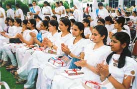 Prize winners of the Guru Nanak Khalsa College for Women applaud the achievements of their classmates during their annual prize distribution function