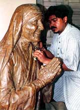 Renowned sculptor Sanat Dinda gives final touches to a bronze statue of Mother Teresa