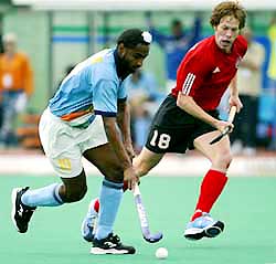 India's Baljit Singh Dhillon tries to get past Canada's Paul Wettlauter 