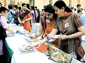 Participants take their pick of traditional Pakistani delicacies from Kitchens of India 