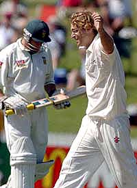 New Zealand's Daniel Vettori celebrates the wicket of South Africa's captain Graeme Smith (left) caught on 25 runs by Jacob Oram on the first day of the first cricket Test at Westpac Park in Hamilton, New Zealand on Wednesday.
