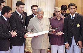 Prime Minister Atal Bihari Vajpayee presents a bat to Indian cricket team captain Saurav Ganguly 