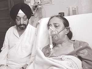 Mr Onkar Singh with his ailing wife, Kamal Singh