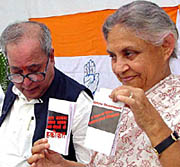 Senior Congress leaders Pranab Mukherjee and Sheila Dikshit release the chargesheet on failures of the NDA government at the AICC office in New Delhi on Thursday.