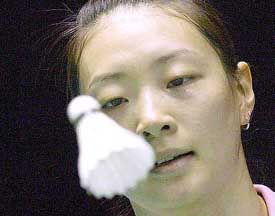 World number one, China's Gong Ruina, keeps her eye on the shuttlecock 