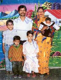 A family photograph of the Gupta family in which Manju is seen carrying her daughter