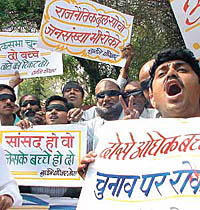Members of Surbhai family during a demonstration demanding boycott of politicans having more then two children at Jantar Mantar in the Capital. 