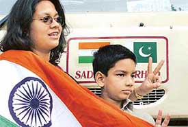 Cricket fans photographed outside the Sada-e-Sarhad bus at Pipli on Friday while proceeding to Pakistan for the first one-day international to be played between India and Pakistan at Karachi