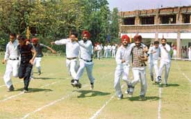 A three-legged race in progress at the annual athletics meet of the Partap College of Education, Hambran road