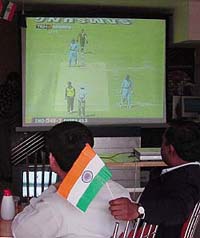 Cricket fans watch the India-Pakistan match at a hotel in Ludhiana 