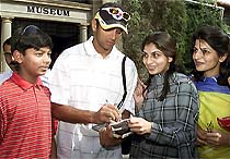 India’s vice-captain Rahul Dravid signs autographs for Pakistani girls during his visit to a museum in the Pakistani city of Taxila