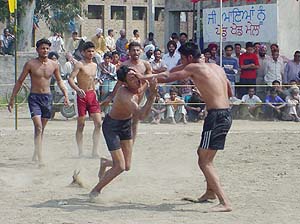 A kabaddi match in progress between Thakkarwal and Dhandran villages at the rural sports festival in Thakkarwal on Sunday.