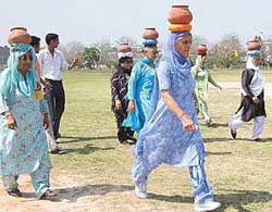 Senior citizens participate in �chatti� race at the Veterans Athletics Competition held at the Dasehra Grounds 