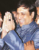 Bollywood star Govinda sports a political smile as he comes out of 10 Janpath after having an audience with Congress President Sonia Gandhi in New Delhi on Monday.