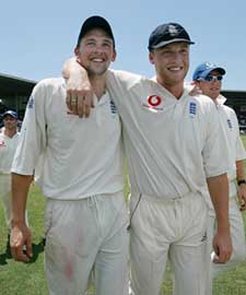 Stephen Harmison, who took seven wickets for just 12 runs to steer England to a memorable 10-wicket victory over the West Indies, walks with teammate Andrew Flintoff
