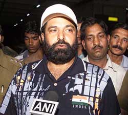 Chief hockey coach Rajinder Singh talks to mediapersons at Indira Gandhi International airport