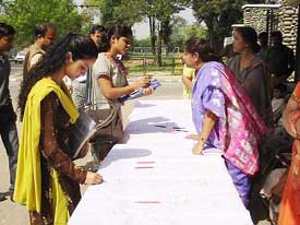 Activists of the Nari Jagran Manch launch a signature campaign in protest against the Women�s Permanent Resident Status (Disqualification) Bill in Jammu on Monday.