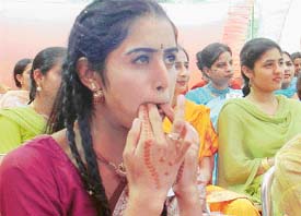 A student of Guru Nanak Girls College whistles during the farewell function at the college