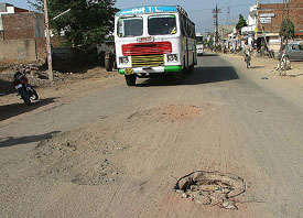 The Bhatti road in Bathinda city, which has developed potholes