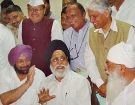 Accompanied by Punjab Chief Minister Amarinder Singh (left), former Chief Election Commissioner of India M.S. Gill and PPCC President H.S. Hanspal share a light moment at the time of filing their nomination papers for the Rajya Sabha