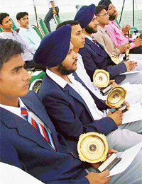 Students with their awards at the prize distribution function of Government College, Sector 46, Chandigarh, on Wednesday.