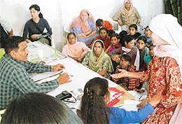 Women take part in an awareness camp at Daddu Majra village on Wednesday.