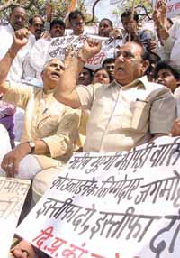 Ch Prem Singh, DPCC president, with actvists sitting on dharna to protest against the large-scale demolition of jhuggis, specially in the New Delhi parliamentary constituency at the behest of the BJP-led central government on the eve of the Lok Sabha elections at Jantar Mantar in the Capital on Wednesday.