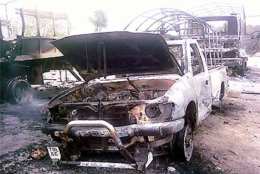 Burnt military vehicles are seen in Kaloosha near South Waziristan, some 360 km southwest of Islamabad