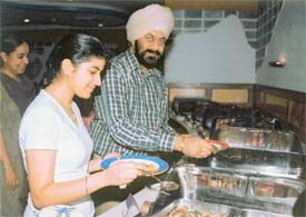 Residents savouring chicken delicacies in a hotel in Ludhiana