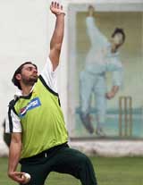 Pakistan�s Shahid Afridi bowls during a training session in Peshawar 